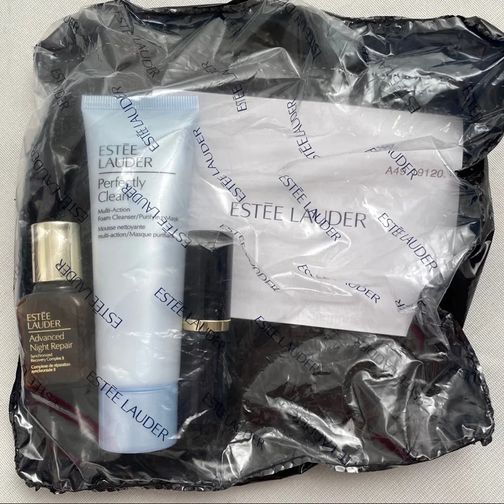 Estée Lauder bag, lipstick, night repair, cleanser
